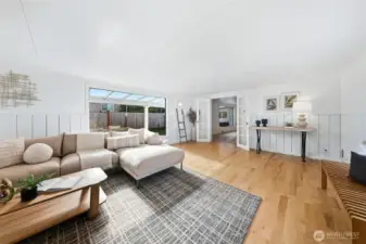 Move through the glass french doors into this living space that is completely bathed in natural light.