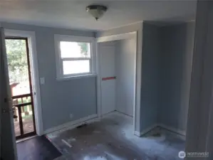 Bedroom 2 with access to back deck.