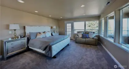 Penthouse suite bedroom overlooks stunning lake views