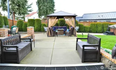 Low maintenance backyard with outdoor kitchen, hot tub!
