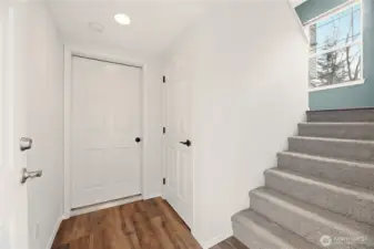 Coat closet to the right. Garage door on the left.