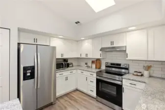 Fully remodeled kitchen with self-closing cabinets and skylight