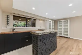 Lower level entertaining space with bar