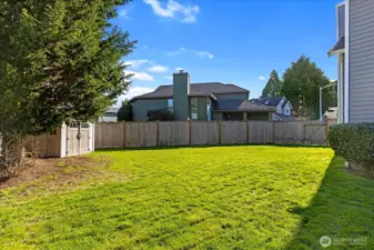 Level and sunny, fully fenced yard w/ shed
