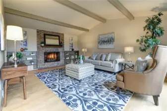 Cozy up by the gas fireplace with brick surround and bookcases