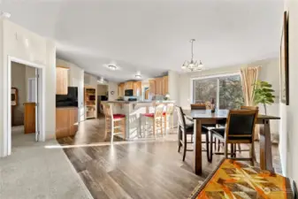 Kitchen is conveniently near sliding door to back deck for BBQ and gatherings in Summer. Dining room flows to breakfast counter with seating. Great space. Easy care vinyl plank floors.