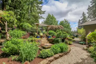 Terraced gardens great you as you approach the front door. Filled with stunning northwest plantings, a patio with an arbor for chilling and a fabulous fountain....it is simply beautiful!