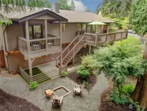 With 2 decks and 2 patios, fire pit and terraced gardens, this backyard is a sanctuary of peace, tranquility, birds and Northwest landscaping at it's finest.