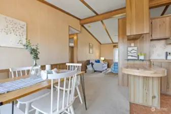 Looking from the dining room toward the living room with the vaulted ceilings and openness.