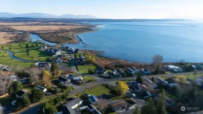 An aerial view showing the home and its proximity to the beach and community center.