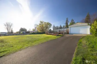 The driveway is asphalt and can park many vehicles and there is also additional or RV parking to the north portion of the property.