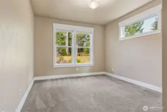 Bedroom 2 overlooks the backyard.