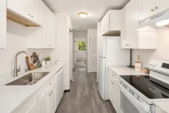 Brand new kitchen with new dishwasher, countertops, sink, faucet, garbage disposal