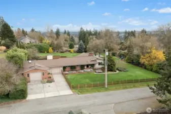Property for sale does not include vacant lot directly to the east. The fence behind the pool (and extending that fence line to the south side of the yard) is the approximate lot line.