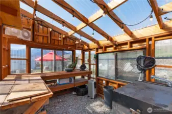 The greenhouse has power, water, vents (including openable windows), and feels so nice and warm inside!