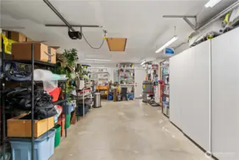 The shelving on the right stays, as does most of the other storage racks the buyer wants.  There is an exit door straight ahead, and to the right of that is the door to the kitchen.