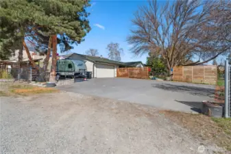 This property has so much parking!  2 cars in the garage, an RV (with 30 amp hookup) tucked next to the garage, and a big paved parking area to accommodate many other vehicles.