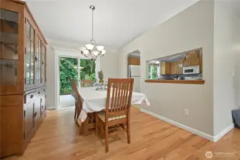 Kitchen overlooks dining room.