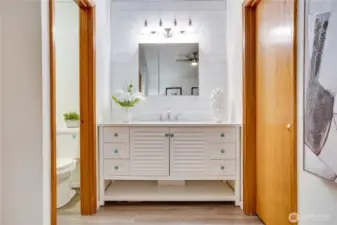 Remodeled vanity with shower to the left and closet to the right.