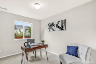 Flexible lower-level bedroom or quiet home office with new carpet and interior paint. A large window brings in natural light and backyard views—ideal for focused work, study, or guest accommodations.