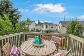 Sun-splashed deck just off the dining area, perfectly placed for grilling and fresh-air meals. Tree-filtered outlooks provide privacy while overlooking the fenced backyard.