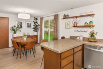 This kitchen offers so much storage space. It was opened up by the current owners by removing the upper cabinetry above the breakfast bar.