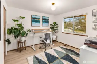 A main floor bedroom that is currently being used as a spacious work-from-home office.