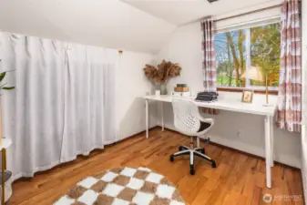 One of the three bedrooms on the upper floor with deep closet spaces.