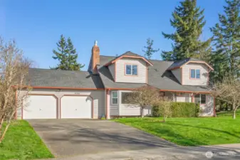 Front shot of the home in daylight showing the brand new roof with high quality GAF tiles.
