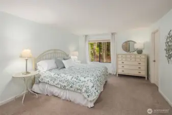 Your primary suite awaits you on the upper level.