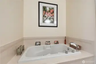 Primary ensuite with tub, dual vanity, shower/powder room.