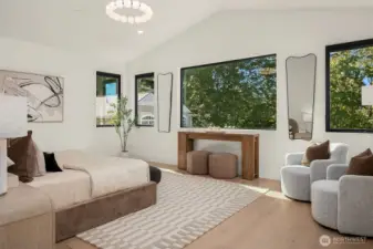 A true retreat: sun-filled primary suite with built-in speakers and a serene peekaboo water view of Lake Washington.