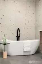 The sculptural bath that serves as a striking centerpiece.