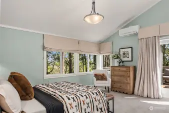 The upstairs level features a luxurious primary ensuite bedroom overlooking the preserved woodland and includes custom black out roman shades and Mitsubishi mini split that heats/cools.