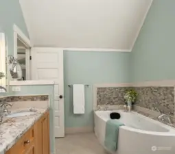 The luxurious spa-like custom bath includes heated floors, stone countertops, Produits Neptune whirlpool bathtub, Rohl fixtures, Toto Neorest toilet and Robern lighted medicine cabinets.  Ahhhh.....