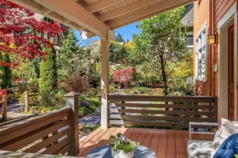 The large, south facing covered front porch is surrounded by lush plantings.  Ohana Cottage is sited in the most private location in the Conover Commons community.