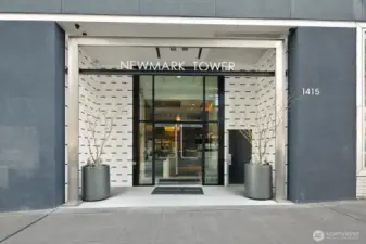 Welcome to the Newmark. Just one block to Pike Place Market.  Concrete and steel building.  24 hr concierge service, pool, spa, sauna, gym, and business center.