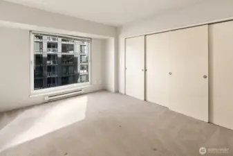 Primary bedroom with double closets.