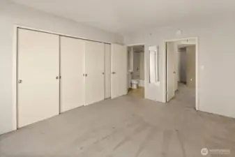Another angle of the primary bedroom looking towards the ensuite bathroom.