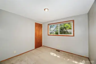 BEDROOM #3  Closet with single door  Window overlooks front yard