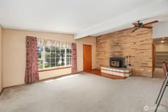 LIVING ROOM   Vaulted ceilings  Ceiling fan / Hardwood floors under carpet  Large picture window
