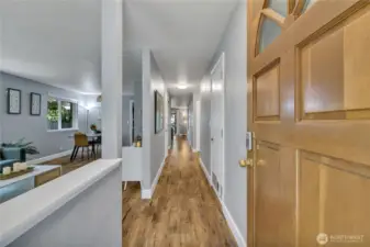 Front entry to foyer and entrance hall. The living room and dining room are to your left. The family room and kitchen are straight ahead!