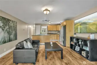 Vinyl plank flooring throughout the whole home adds to the aesthetic. The walls are freshly painted.