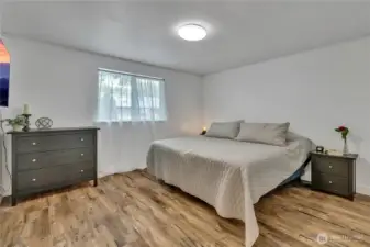 Spacious primary bedroom has its own full bathroom with two sinks, as well as a walk-in closet. Again, fresh paint and vinyl plank flooring thoughout.