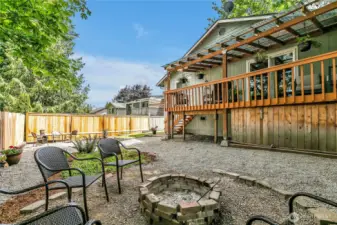 Enjoy evenings of cozy conversations around the built in firepit.