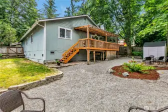 View of the backyard and covered deck.