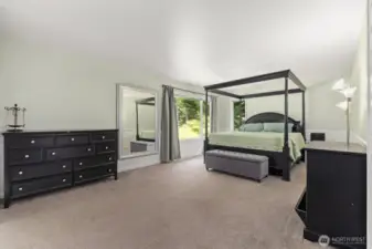 Primary suite has plenty of space in the bedroom.