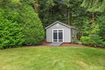 Cute and functional garden shed in the back corner of the property.