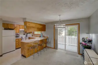 Sliding door leads to the fully fenced back yard.
