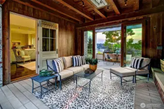 Step outside to the outdoor, heated living room. One could entertain year round in this room.